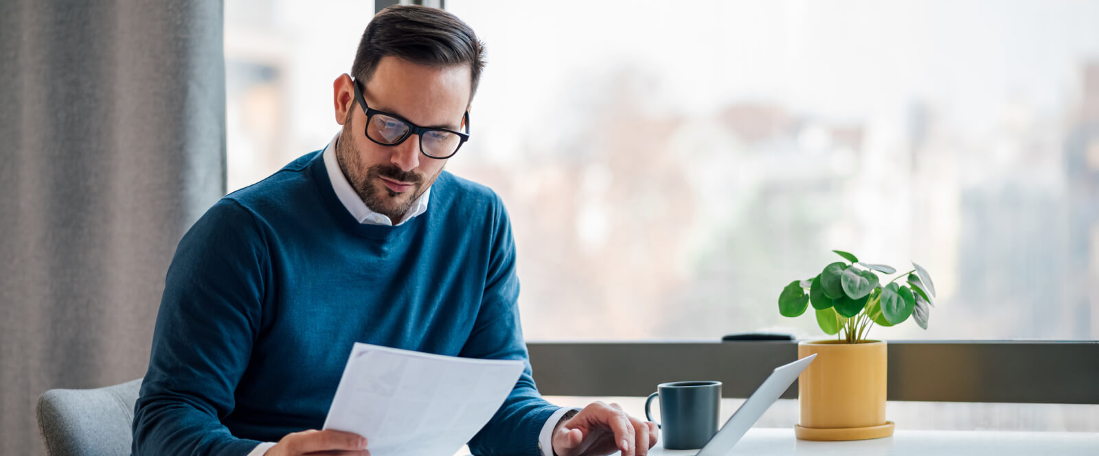 business person holding document